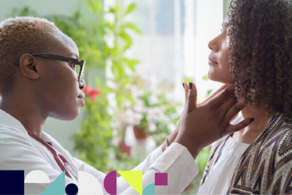 Black female doctor examines Black female patient