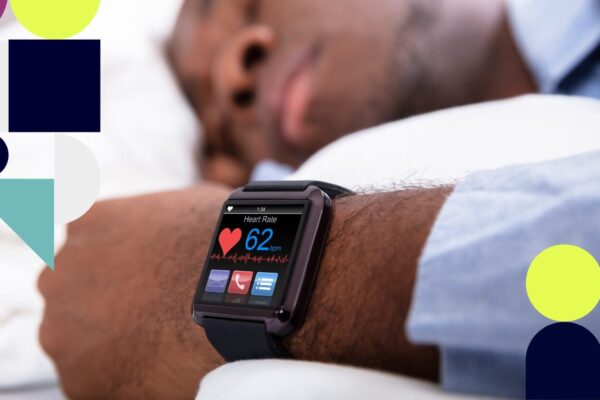 Smartwatch measuring a man’s pulse during sleep